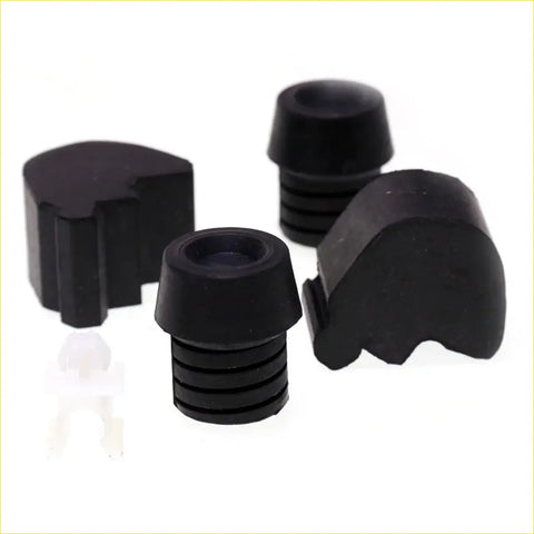 Black rubber protective caps for furniture legs with ridged texture and rounded tops for Nissan D21 bumper rod use