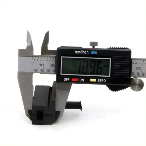 Black digital caliper with silver jaws measuring 18.96 mm for bonnet bumper rubber on Nissan Datsun Ute 1965-1997