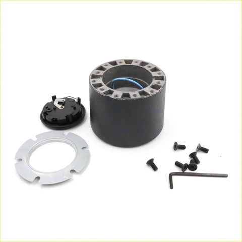 Black cylindrical steering wheel hub adapter with metallic flanges and blue wiring for Toyota Hilux N80 RN90 RN105 back view