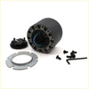 Backside of black cylindrical motor housing with blue wiring and metal flanges in boss kit steering wheel hub adapter for Toyota Hilux