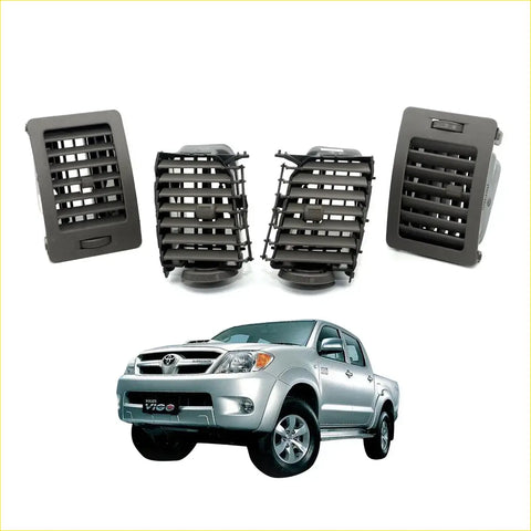 Gray plastic dashboard air vents for Toyota Hilux pickup trucks shown from the back side in a brown air vent grille product image