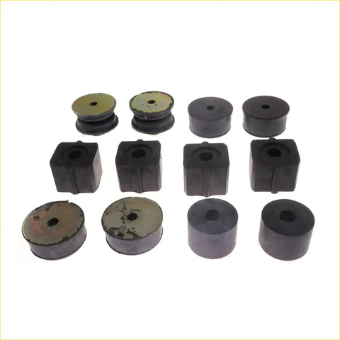 Black rubber cabin mounting bushings in various shapes and sizes with some worn metallic tops for mitsubishi triton l200