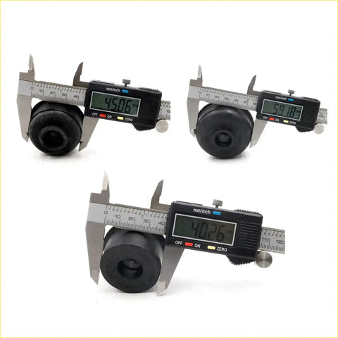 Black rubber cylindrical cabin mounting bushings for Toyota Hilux LN80 LN85 LN90 YN80 being measured with digital calipers
