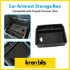 Black plastic car armrest storage box with textured interior and molded compartments for toyota center console