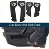 Black car door anti kick pad stickers with white starburst cutouts installed on Toyota Land Cruiser interior door panel