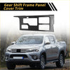 Black carbon fiber gear shift frame panel cover trim with textured surface and cutouts for toyota tundra