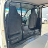 Black metal mesh cargo barrier installed inside a toyota hiace 2005-2019 narrow body van separating driver and rear space