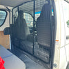 Black metal cargo barrier with grid pattern inside toyota hiace 2005-2019 narrow body van separating cargo and passengers
