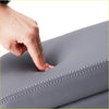 Gray faux leather centre console armrest with white stitching for car interior protection and style