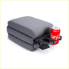 Gray faux leather centre console armrest with integrated black plastic cup holder for car interior use