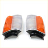 Pair of chrome corner indicator lights for toyota hilux 1983-1988 with orange and clear lenses and black bases