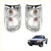 Pair of chrome rear tail lights for mazda b series bravo with clear textured lenses and amber red indicators