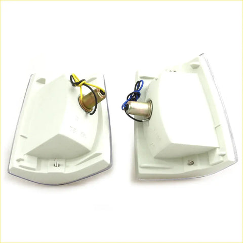 White plastic clear corner turn signal lights set for mazda b2000 b2200 b2600 showing back side with wiring