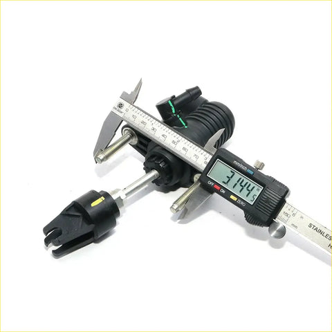 Black plastic and metal clutch master cylinder for toyota hilux revo 2015-2024 being measured with digital caliper