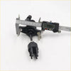 Black plastic clutch master cylinder connector with metallic pins and caliper measuring 19.85 mm for toyota hilux