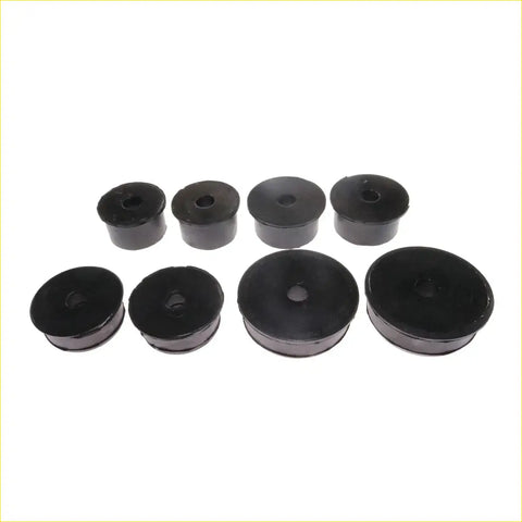 Set of black rubber cabin mounting bushings with central holes and different sizes for toyota hilux 1997-2005