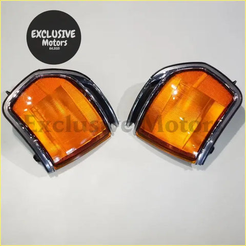 Pair of chrome finished orange corner turn signals with sleek angular design for toyota land cruiser lc80 fj80