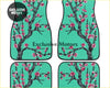 Set of four teal car floor mats with black cherry blossom tree design and pink flowers for custom car interiors
