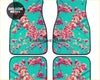 Set of four custom pink blossom car floor mats with vibrant turquoise background and pink white cherry blossoms