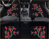 Black car floor mats with vibrant red cherry blossom designs on gray branches custom made for stylish interiors