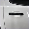 Black matte-finish door handle cover for white mazda bt-50 2012-2020 smart key vehicle visible from the back side