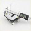Back side of silver metal door lock actuator with black rubber parts and gold screws for toyota hilux 4wd 1988-1997