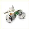 Silver-toned cylindrical door lock cylinders with matching keys and green-orange parts for Mitsubishi Triton L200 78-86