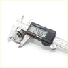 A shiny chrome lock cylinder being measured with a digital caliper for a toyota hilux door lock retainer clip