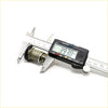 A black digital caliper measuring a brass door lock component for toyota hilux 1978-1983 x2 set