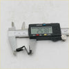 Black digital caliper measuring a small black metal door panel clip from a set for Mazda 808 RX series at 25.38 mm