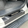 Black plastic door sill plate for Toyota Hilux 2015-2025 with silver hilux logo perfect for vehicle protection