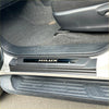 Black plastic door sill plate for Toyota Hilux 2015-2025 with silver hilux logo inlay for vehicle protection