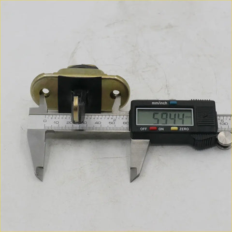 Brass-colored metal door stopper latch with black plastic insert and two mounting holes for toyota hilux ln140-170