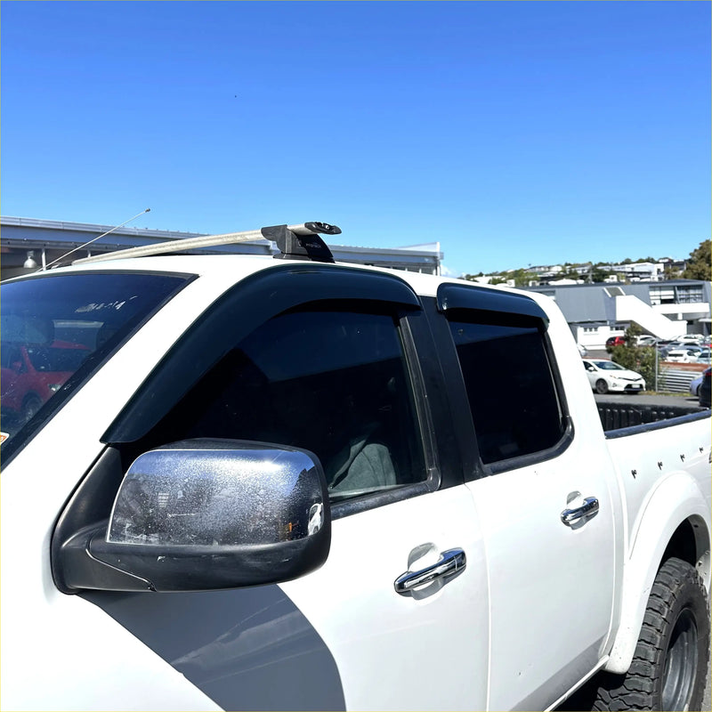 Black plastic door visors weather shields mounted on white ranger pj pk pickup truck windows for rain protection