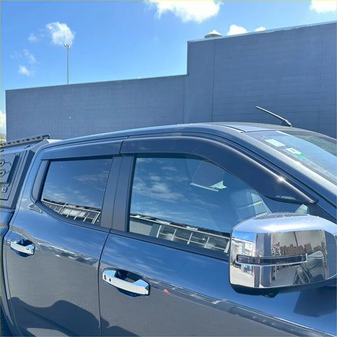 Black plastic door visors window monsoons installed on dark gray mitsubishi triton 2024+ pickup truck