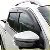 Black plastic door visors window monsoons weather shields installed on white nissan navara np300 pickup truck