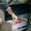 Silver-framed compact car fridge with digital temp display and sliding drawer filled with soda for ute and offroad use