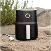 Black air fryer with silver dial and white handle in family ultimate kitchen perfect for offroad ute meals