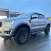 Silver ford ranger px3 2019-2021 with black wheels and side steps featuring smooth style 4-inch fender flares with senor