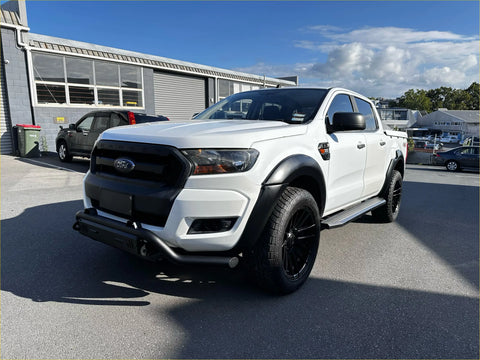 White ford ranger px2 2016-2018 with smooth style matte black 6-inch fender flares and rugged black tires