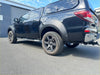 Black mazda bt-50 pickup with glossy finish and chrome accents featuring matte black 9-inch bolt style fender flare