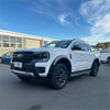 White ford ranger 2022 with matte smooth style fender flares black accents and rugged tires for wildtrak model