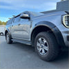 Silver ford ranger 2022 with matte black smooth sport style fender flares and rugged all-terrain tires