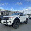 White ford ranger px1 2012-2015 with black oem style fender flares and rugged off-road tires