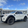 White ford ranger px1 2012-2015 with black oem style fender flares, rugged off-road tires, and front bull bar