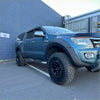 Dark blue ford ranger px1 2012-2015 with lychee texture bolt style fender flare and black aftermarket wheels roof rack