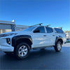 White mitsubishi triton 2019-2023 with matte black bolt style fender flares and roof rack shown from the side