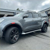 Gray metallic nissan navara pickup with black alloy wheels and roof rack featuring red layer fender flare np300 2015-2020