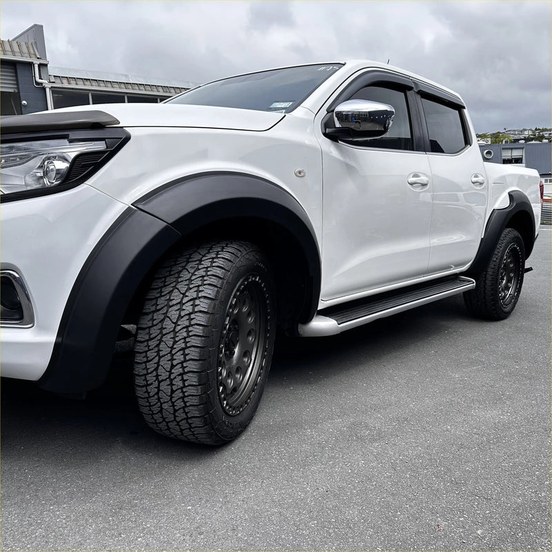White nissan navara np300 pickup with matte black fender flares alloy wheels and side steps oem style 2015-2020