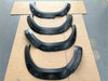 Black matte fender flares for toyota hilux 2021-2024 sr sr5 with sleek curved design and bolt style mounting holes